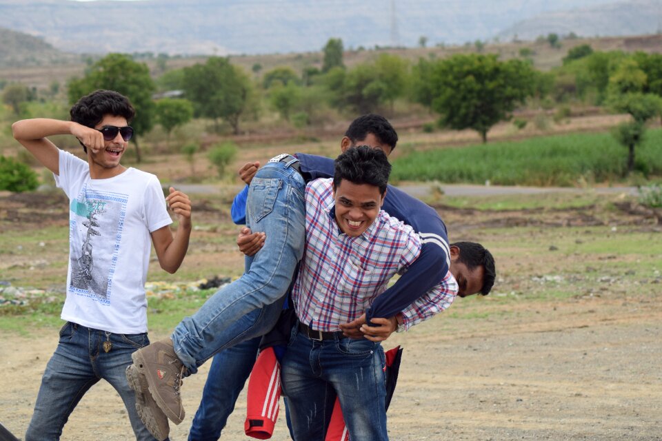 Adult friends group play fighting