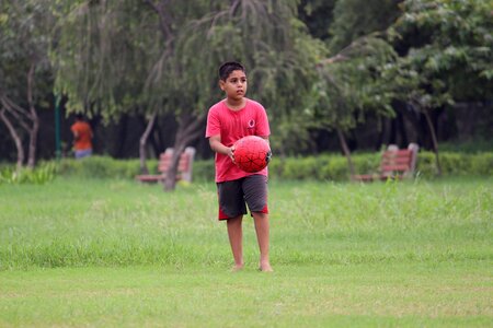 Child strong green football