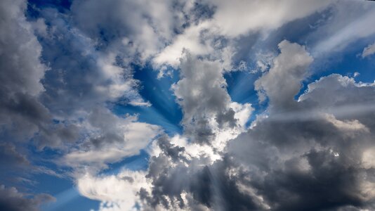 Clouds form bright rays photo