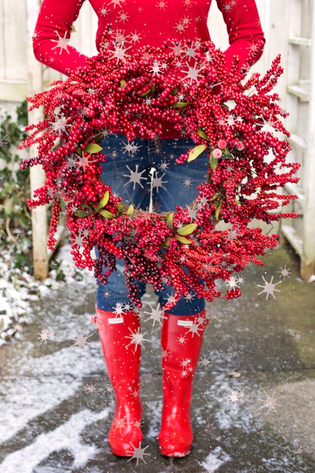 Woman holding red boots