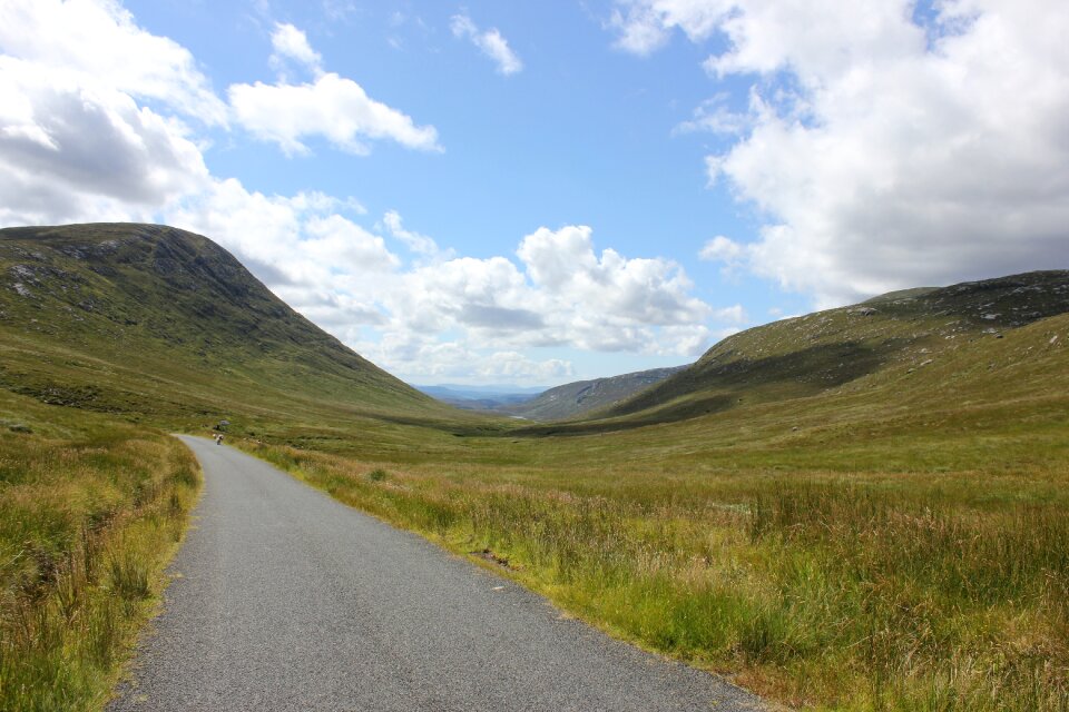 Road in the green summer grass photo