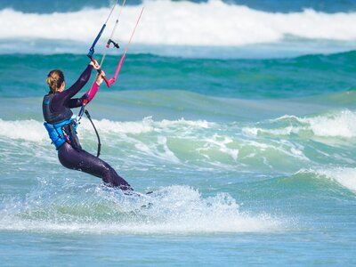 Kite-surfing female action photo