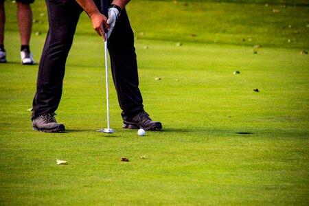 Golfers golf course putting