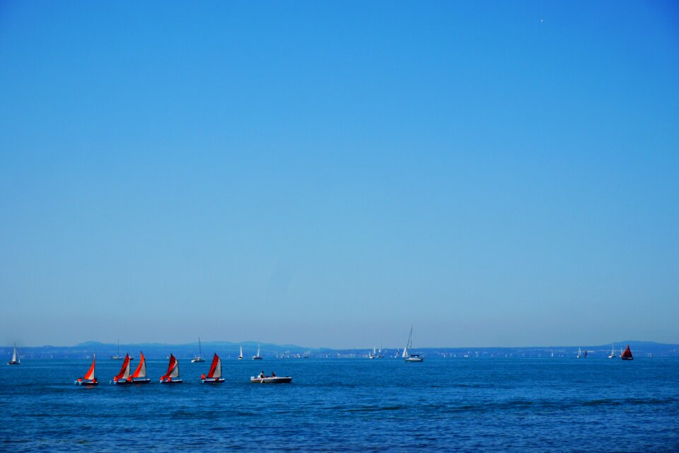 Alpine mountains boats photo