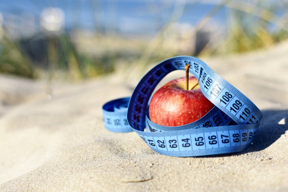Blue tape vitamins red apple