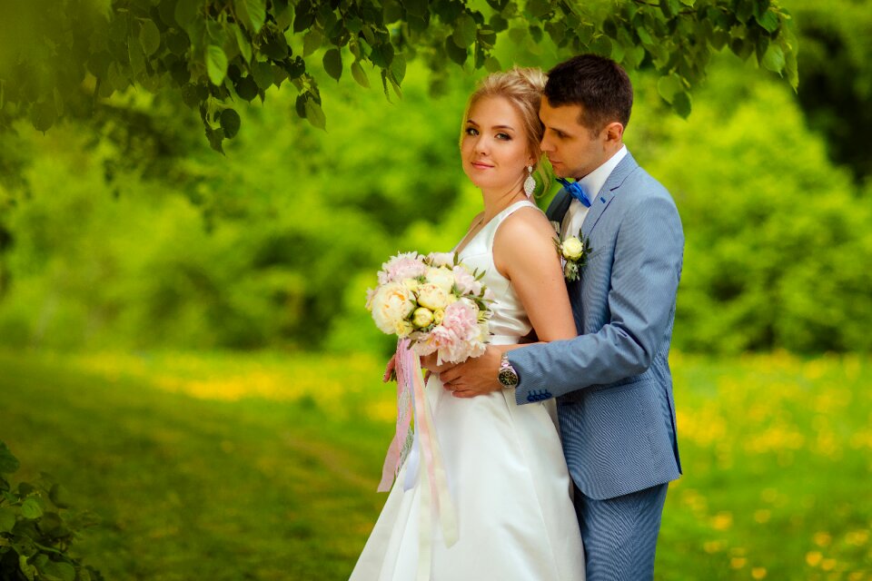 Together through life the happy couple bride with bouquet