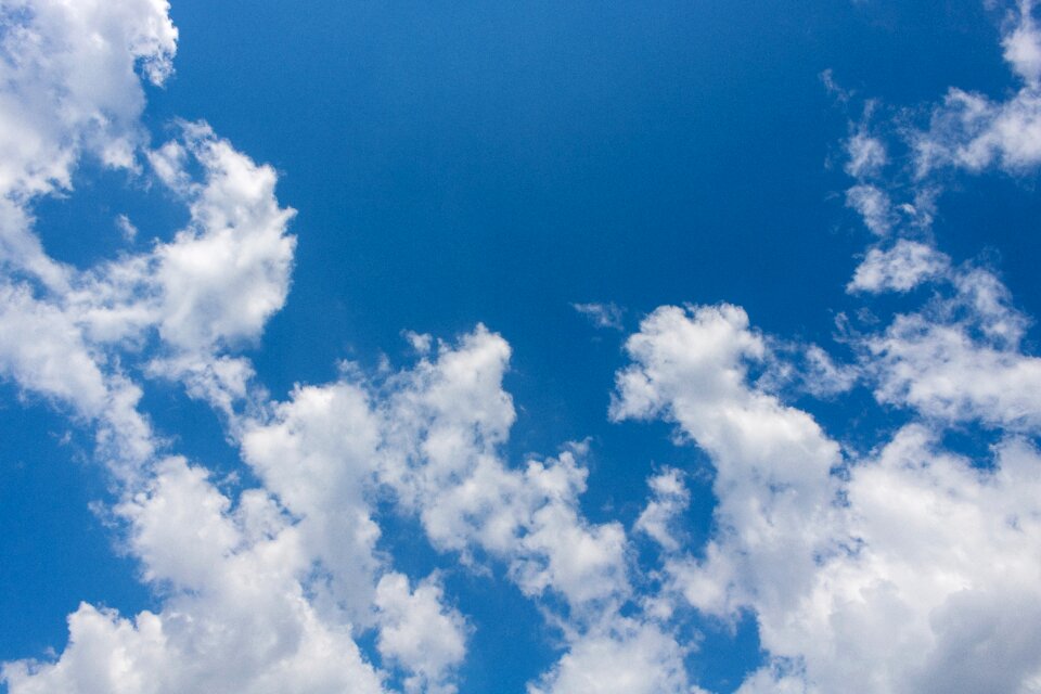Fluffy cloudscape blue background