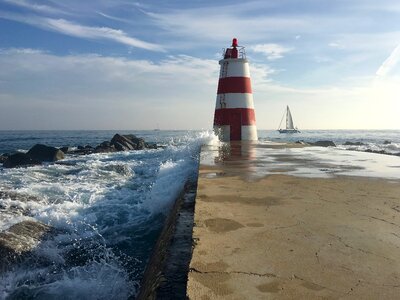 Lighthouse pier rocks photo