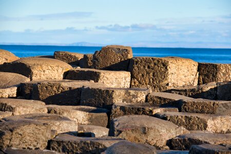 Columnar basalt cliff sea photo