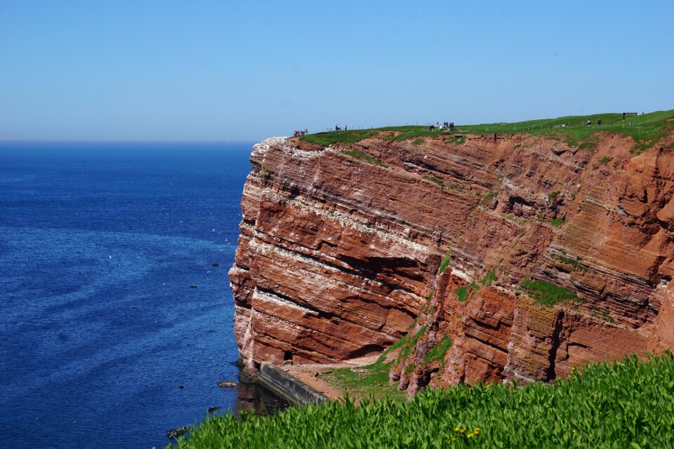 Rock sea blue sky photo