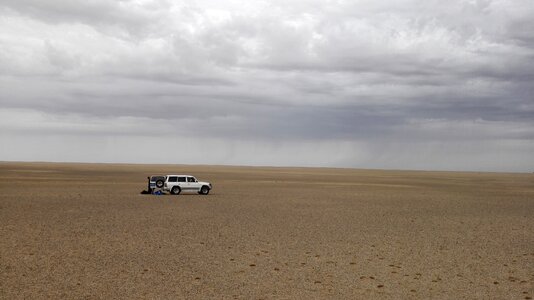 Desert dark clouds off road buggy photo