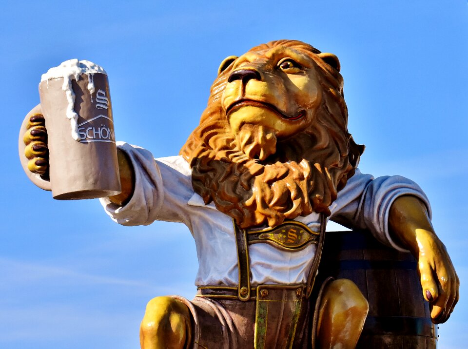 Figure drinking beer sculpture