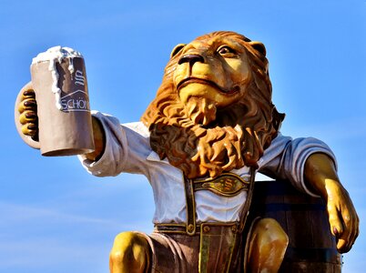 Figure drinking beer sculpture