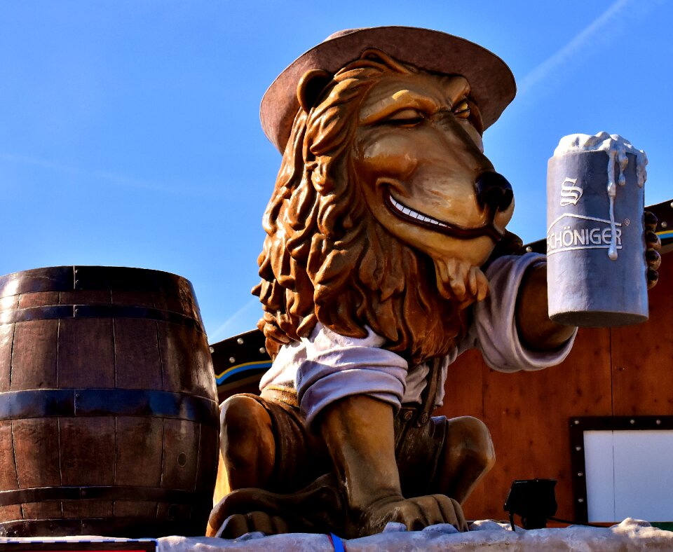 Figure drinking beer sculpture