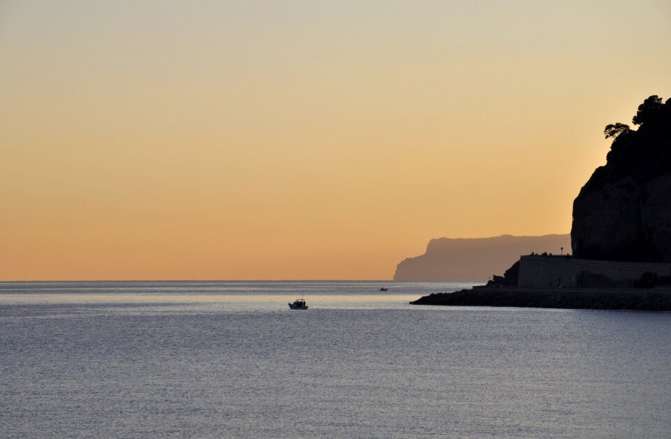 Promontory evening water photo