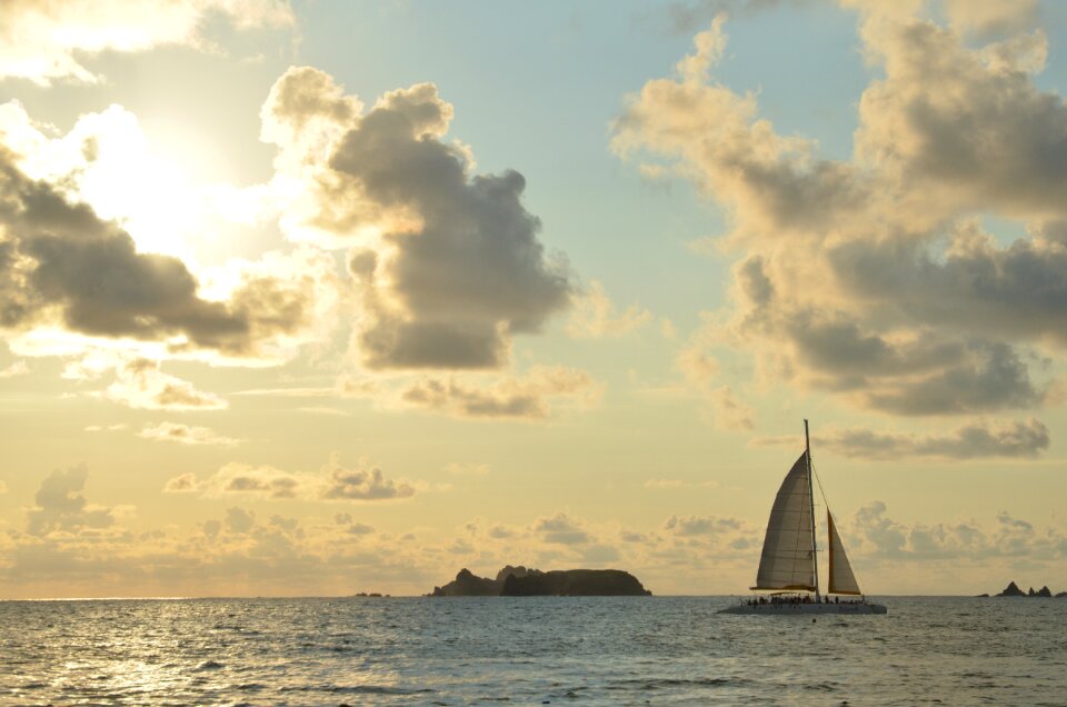 Sailboat clouds sun