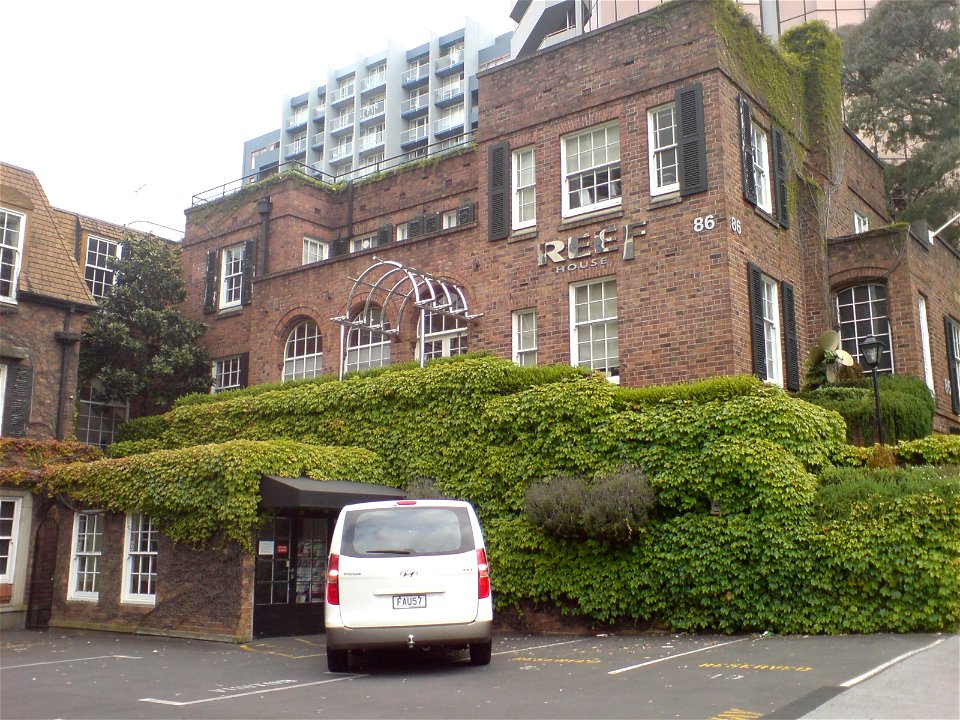 Reef House, the offices of Reef Shipping, a ocean shipping company headquartered in Auckland City, New Zealand. They primarily serve Polynesia. The van depicted is a 2009 Hyundai H-1 2.5 CRDI 8-seater
