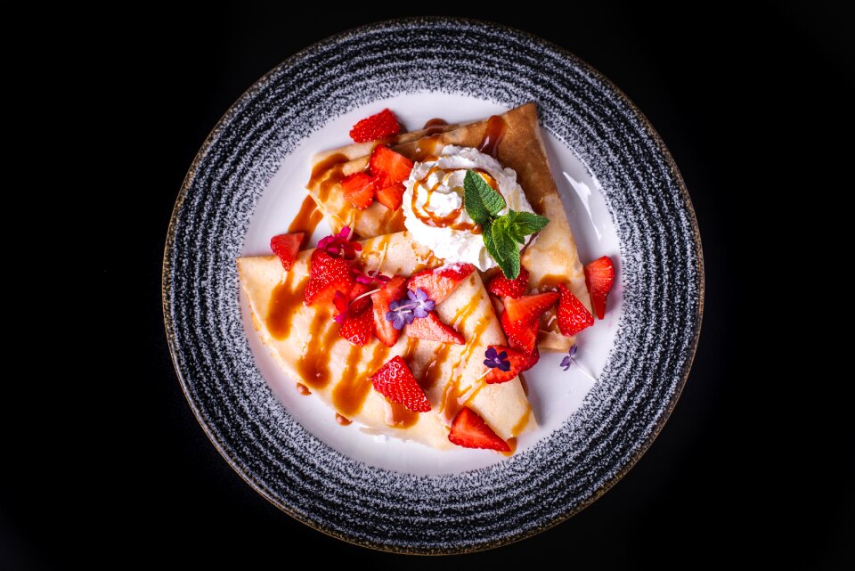 Strawberries whipped cream pancakes with whipped cream