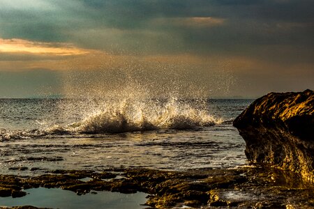 Sea sunset splash photo