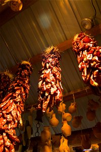 Ristras of chili peppers drying. photo