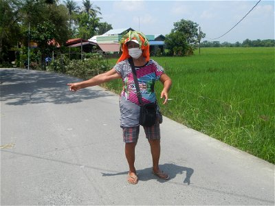 Smoking women with carica papaya leaves hat