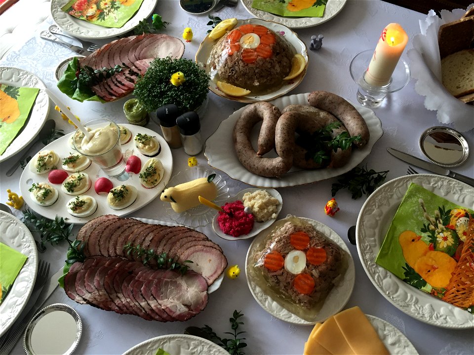 Polish Easter breakfast, including cold cuts, sausages, meat aspics, stuffed eggs, beetroot-and-horseradish relish, garden cress and a lamb carved out of butter.