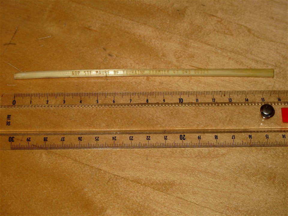 Rye straw from a french cheese Sainte-Maure de Touraine. It is engraved with "AOP Sainte Maure de Touraine Fermier 41 043 00371"