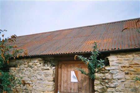 Building with a rusted corrugated iron roof. photo