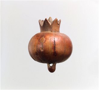 Pomegranate carved in the round photo