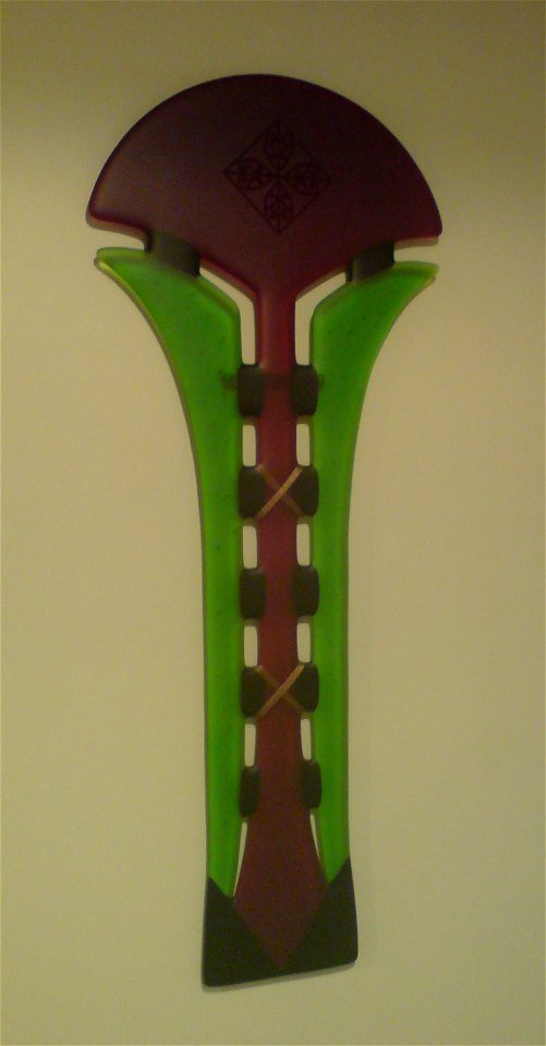 A photograph of the artwork 'Pohutukawa' by Te Rongo Kirkwood. Fused glass with copper banding. The artwork is owned by the uploader.
