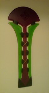 A photograph of the artwork 'Pohutukawa' by Te Rongo Kirkwood. Fused glass with copper banding. The artwork is owned by the uploader.