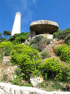 Lighthouse and blockhauss at the end of the presqu'isle of Cap-Ferrat, Alpes-Maritimes, France. photo