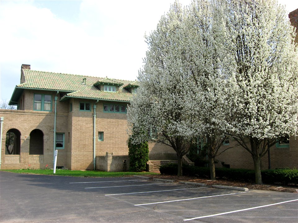 Flowering trees on the northern side of the Wheeler-Stokely Mansion, located at 3200 Cold Spring Road in Indianapolis, Indiana, United States.  Built in 1912, it is listed on the National Register of 