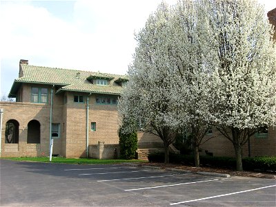 Flowering trees on the northern side of the Wheeler-Stokely Mansion, located at 3200 Cold Spring Road in Indianapolis, Indiana, United States.  Built in 1912, it is listed on the National Register of 
