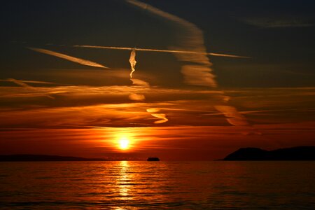 Clouds airplane trails dusk
