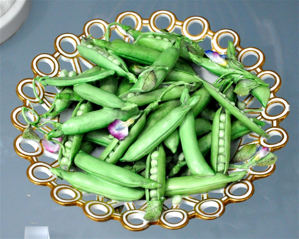 Dish filled with peas and pease blossom; bone china painted with enamels and gilded. Made by Minton & Co., Stoke-on-Trent, c. 1825

Victoria and Albert Museum, London, museum no. 414:810/A-1885 (L