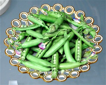 Dish filled with peas and pease blossom; bone china painted with enamels and gilded. Made by Minton & Co., Stoke-on-Trent, c. 1825

Victoria and Albert Museum, London, museum no. 414:810/A-1885 (L