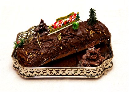 A home made "Bûche de Noël" (yule log), this one is chocolate filled with raspberry jam. French traditional dessert for Christmas. photo