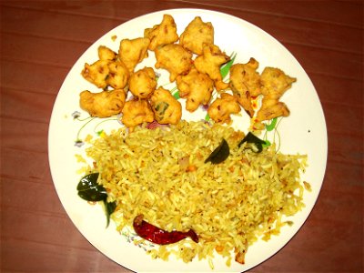A breakfast from the Rayalaseema cuisine made of steamed puffed rice with a combination of fritter. The puffed rice part is called Uggani, Ogirani, Borugula Tiragavata, Bourugula Chitrannam and the fr