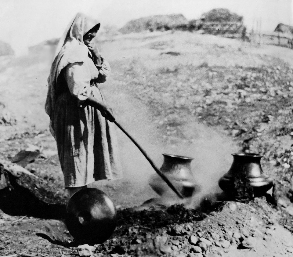 Tewa artist, Sara Fina Gutierrez Tafoya, native name "Autumn Leaf" pit-firing blackware pottery at Santa Clara Pueblo (Kha'po Owingeh), Northern New Mexico around 1900. Collection of the Maxwell Museu