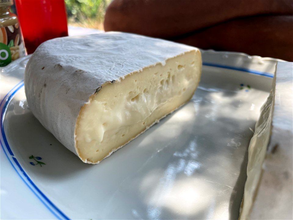 a Brick sized Camembert cut in half, right half
