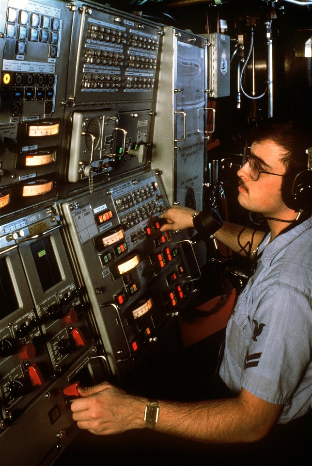 A crewman monitors the torpedo tube control panel in the torpedo room of the nuclear-powered attack submarine USS CITY OF CORPUS CHRISTI (SSN 705)