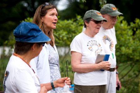 Kelly Wilson, second left, gives remarks to nearly 30 attendees of a Monarch Butterfly release with volunteers from the Monarch Teacher Network in Arlington National Cemetery, Sept. 1, 2016, in Arling