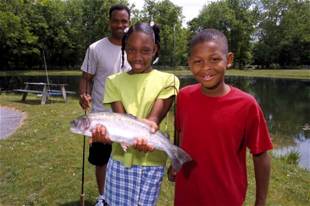 Image title: Son and daughter proudly show off rainbow trout they caught with their father Image from Public domain images website, http://www.public-domain-image.com/full-image/people-public-domain-i photo