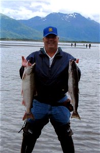 Image title: Fisherman holds fish silver coho salmon Image from Public domain images website, http://www.public-domain-image.com/full-image/sport-public-domain-images-pictures/fishing-and-hunting-publ photo