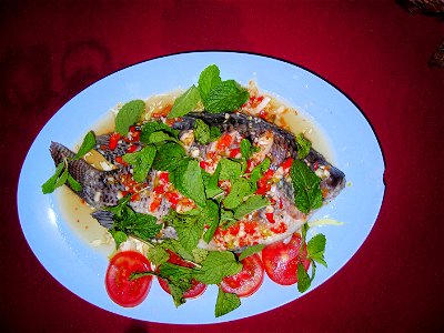 (Thai: ปลานึ่งมะนาว): Fish steamed with lime juice. The fish is pla nin (Thai: ปลานิล, Oreochromis niloticus) so this dish would in full be called pla nin nueng manao (Thai: ปลานิลนึ่งมะนาว).
Most rec