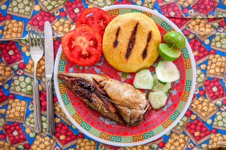 Food from Margarita Island. Salad, arepa, lemon and Cataco fish (Trachurus lathami) photo