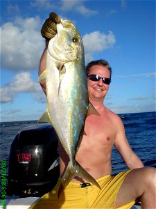 Andre holding a Yellow Jack caught 2 miles off Hillsboro Inlet, Florida photo
