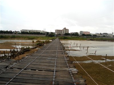 Wooden Bridge over the Nandu River at Dingcheng, Ding'an, Hainan, China. Camera facing south at Dingcheng (visible at the shore).