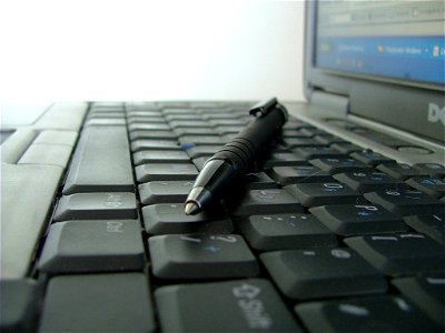Photo of keyboard and pen photo